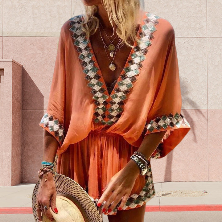 "Boho jumpsuit för kvinnor i polyester med tryckt mönster, kort ärm och lös passform, perfekt för sommar och strand."