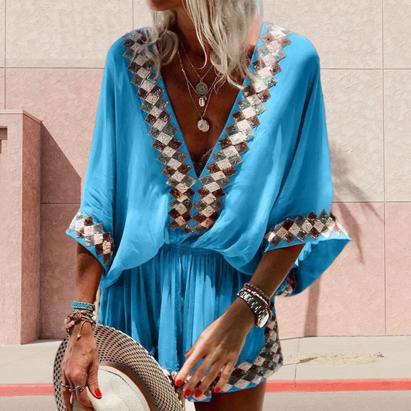 "Boho jumpsuit för kvinnor i polyester med tryckt mönster, kort ärm och lös passform, perfekt för sommar och strand."