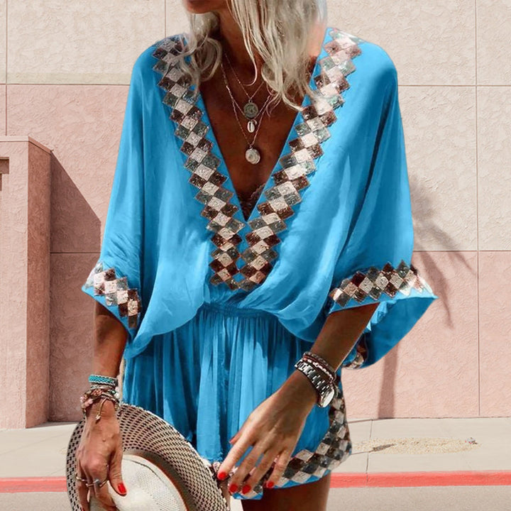 "Boho jumpsuit för kvinnor i polyester med tryckt mönster, kort ärm och lös passform, perfekt för sommar och strand."
