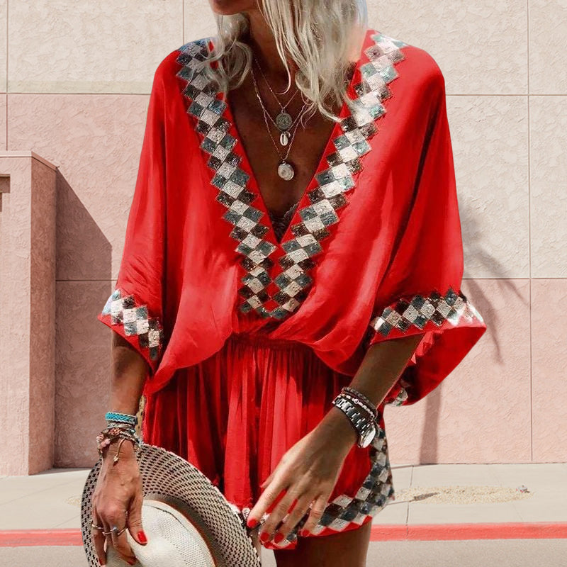 "Boho jumpsuit för kvinnor i polyester med tryckt mönster, kort ärm och lös passform, perfekt för sommar och strand."