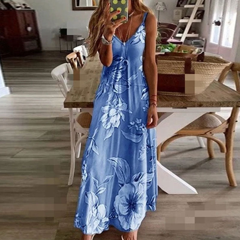 "Boho maxiklänning med färgglatt blommigt tryck, V-ringad, ärmlös, perfekt för sommar. Ger en elegant och avslappnad stil."
