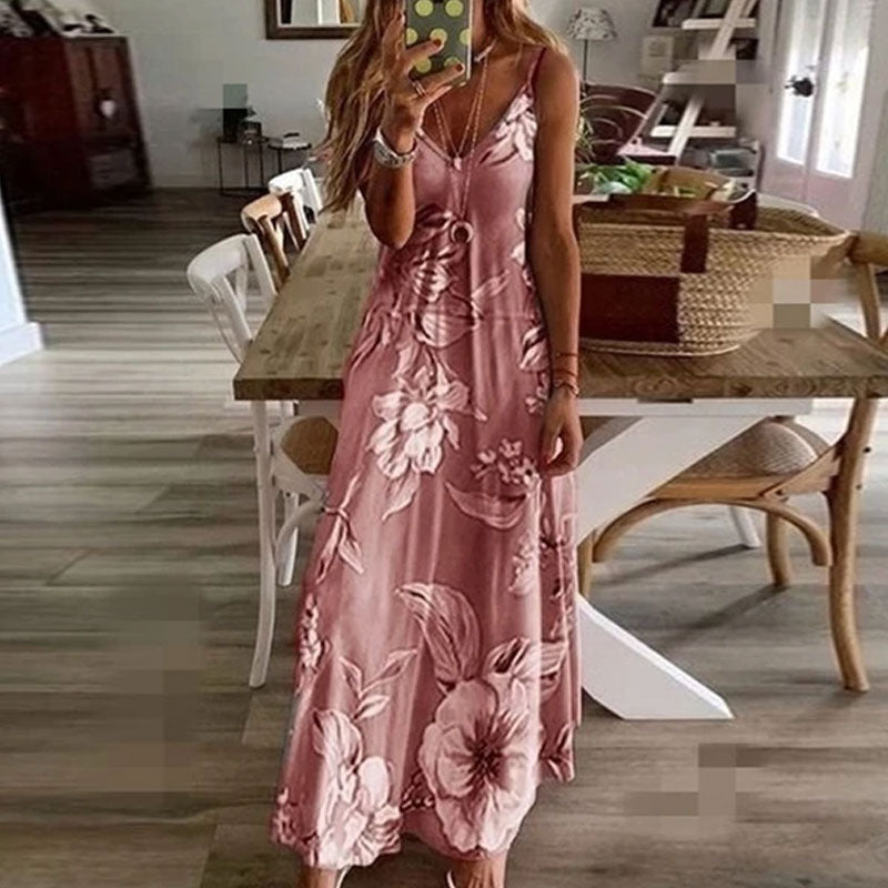 "Boho maxiklänning med färgglatt blommigt tryck, V-ringad, ärmlös, perfekt för sommar. Ger en elegant och avslappnad stil."
