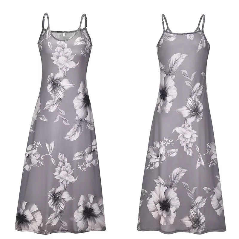 "Boho maxiklänning med färgglatt blommigt tryck, V-ringad, ärmlös, perfekt för sommar. Ger en elegant och avslappnad stil."