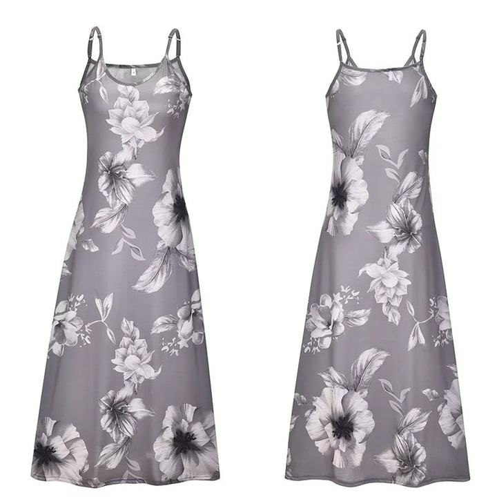 "Boho maxiklänning med färgglatt blommigt tryck, V-ringad, ärmlös, perfekt för sommar. Ger en elegant och avslappnad stil."