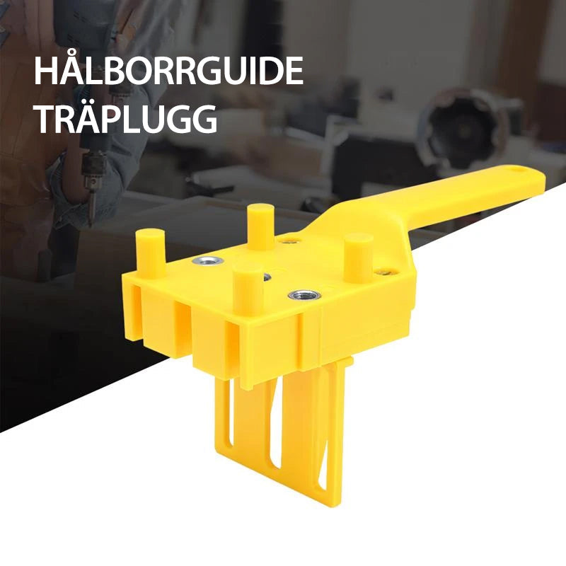 "Borrjigg för hantverkare, justerbar och precis, i slitstarkt plast och metall för snabb och exakt borrning."