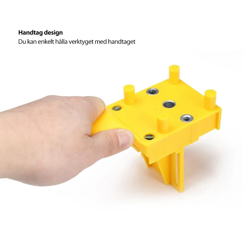 "Borrjigg för hantverkare, justerbar och precis, i slitstarkt plast och metall för snabb och exakt borrning."