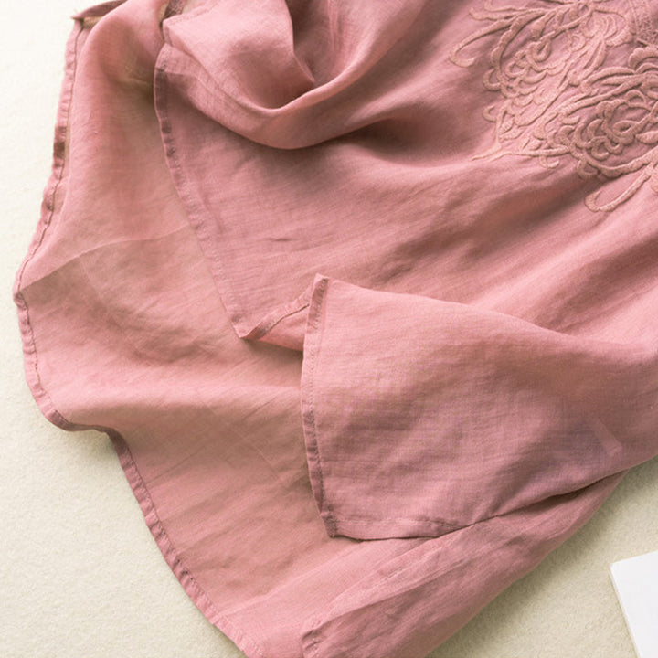 "Broderad dam-t-shirt med kort ärm i bomull och V-hals, elegant broderi, perfekt för sommarens stilfulla dagar"
