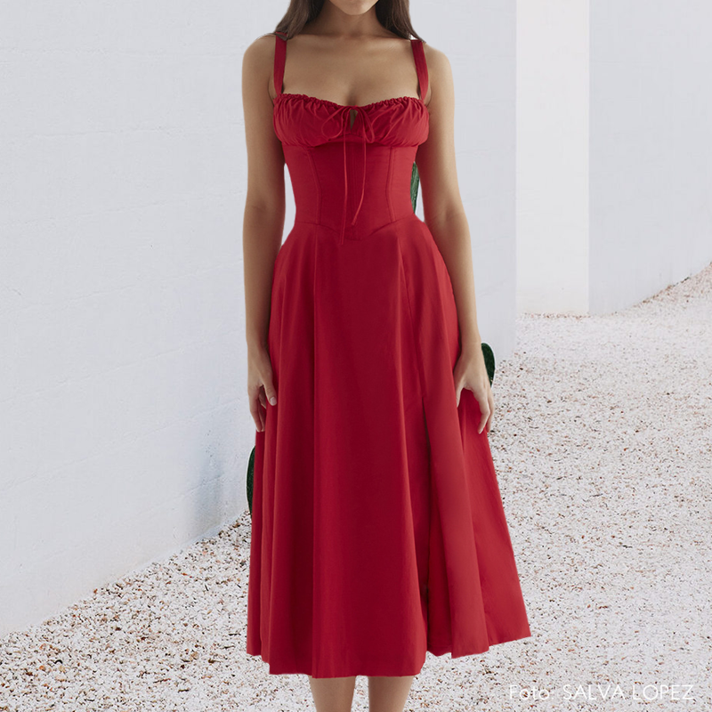 "Carmen Tryckt Bustier solklänning med elegant tryck och bustier liv, perfekt för sommarfester och feminina uttryck."