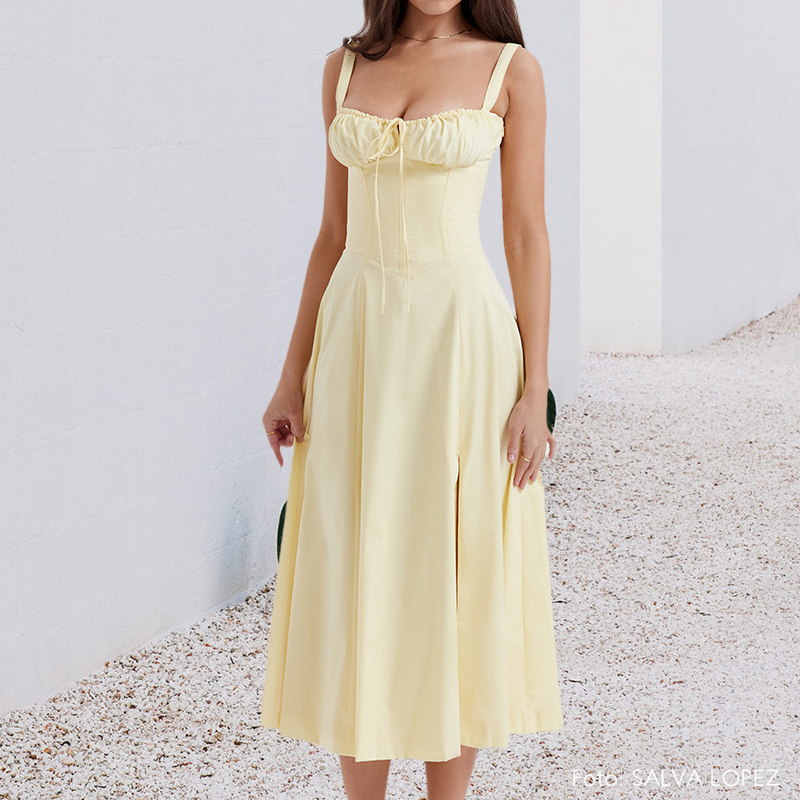 "Carmen Tryckt Bustier solklänning med elegant tryck och bustier liv, perfekt för sommarfester och feminina uttryck."