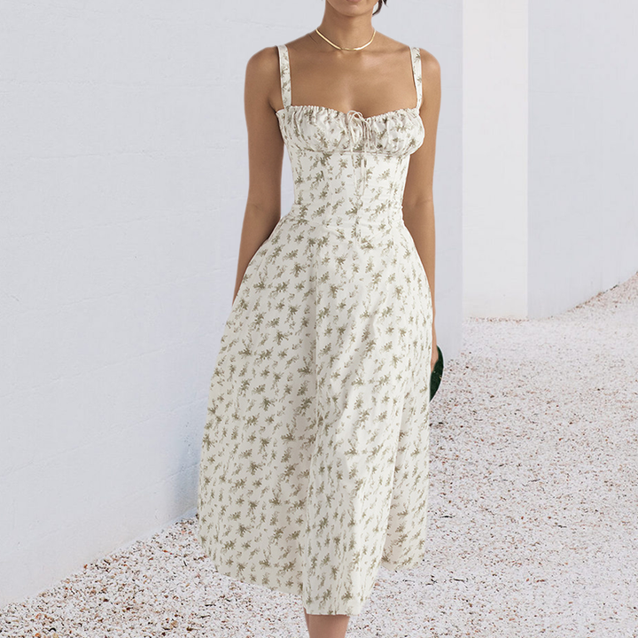 "Carmen Tryckt Bustier solklänning med elegant tryck och bustier liv, perfekt för sommarfester och feminina uttryck."