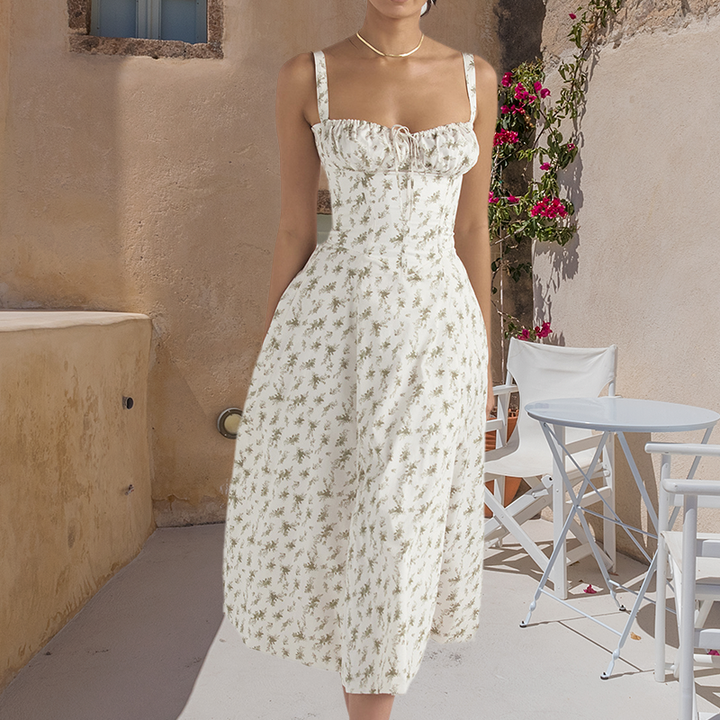"Carmen Tryckt Bustier solklänning med elegant tryck och bustier liv, perfekt för sommarfester och feminina uttryck."