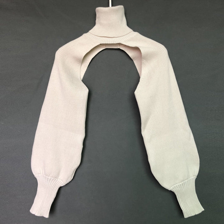 "Coltröja med hög hals och loose bloomer-ärmar, eleganta detaljer för chic look. Perfekt för dammode, olika färgval."