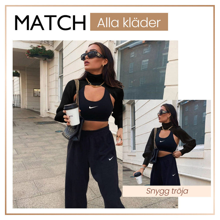 "Coltröja med hög hals och loose bloomer-ärmar, eleganta detaljer för chic look. Perfekt för dammode, olika färgval."
