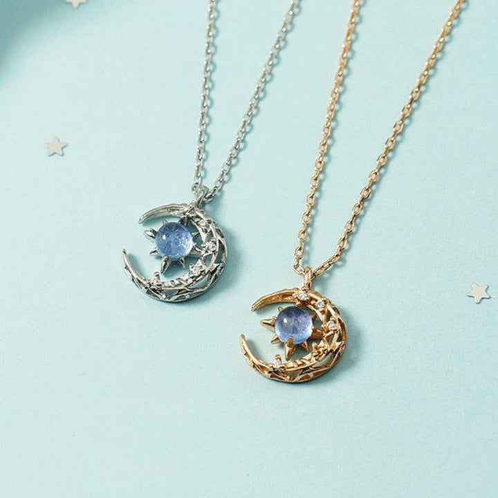 "Dam Astral Måne Halsband i rosé guld och silver, med måne och stjärndesign, justerbar kedja, smyckeaccessoar."