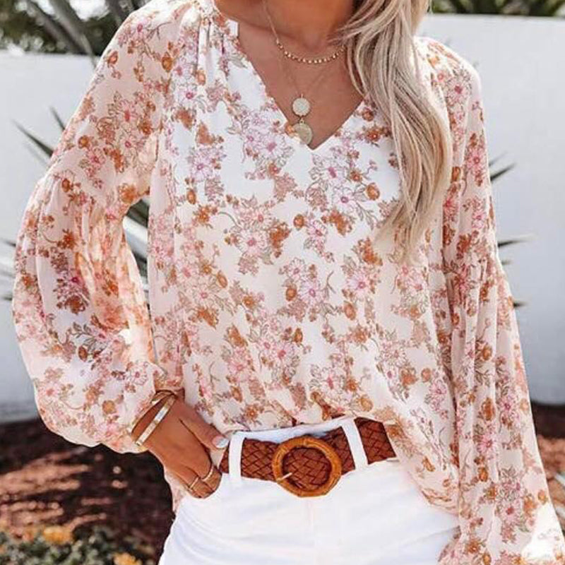 "Dam blommig boho blus, V-ringad långärmad, färgglatt blommönster på mjukt tyg, elegant och avslappnad design."