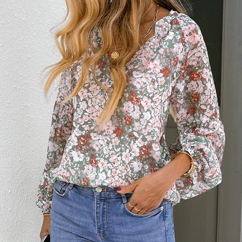 "Dam blommig boho blus, V-ringad långärmad, färgglatt blommönster på mjukt tyg, elegant och avslappnad design."