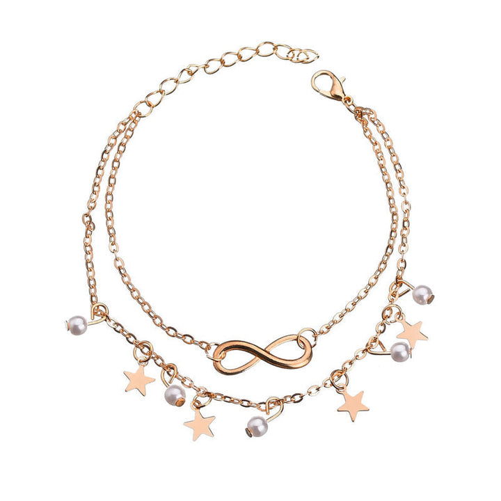 Dam boho ankelarmband i silver och guld, elegant design med geometriska former, perfekt för stil och komfort.