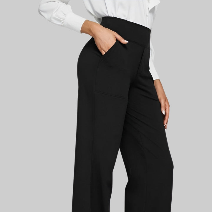 Stilrena dam byxor med hög midja och praktiska fickor, eleganta modebyxor.