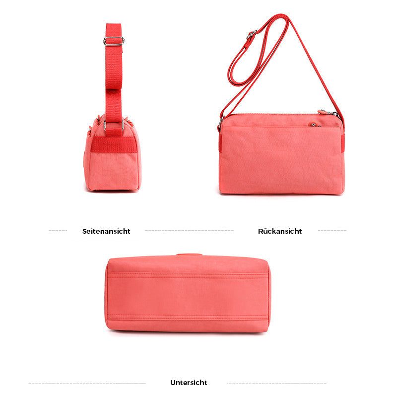 "Dam casual nylon crossbody väska i flerfärgat mönster med justerbar rem och flera fack, stilren design."