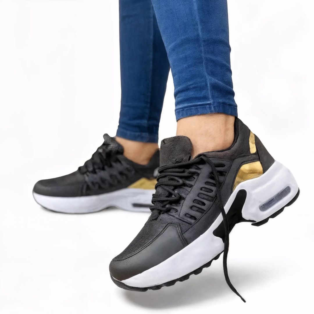 Detaljbild på halkfri sula på dam sneakers. Ger säkert grepp för bekväma promenader.