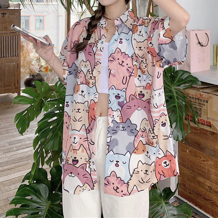 "Dam Happy Cat blus med kort ärm och kattmönster, bomullspolyester, luftig design för sommarstil."