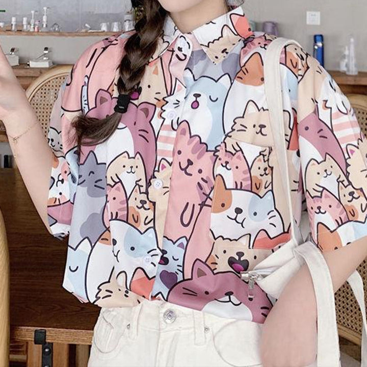 "Dam Happy Cat blus med kort ärm och kattmönster, bomullspolyester, luftig design för sommarstil."