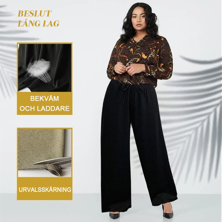"Dam plus size vida byxor med hög midja, i silkesmjukt tyg och olika färger, elegant draperade för stil och komfort."