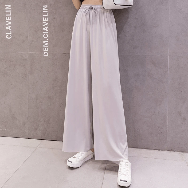 "Dam plus size vida byxor med hög midja, i silkesmjukt tyg och olika färger, elegant draperade för stil och komfort."