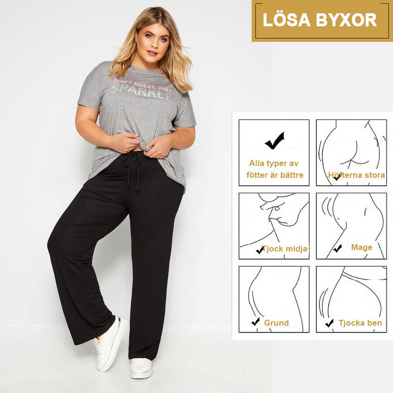 "Dam plus size vida byxor med hög midja, i silkesmjukt tyg och olika färger, elegant draperade för stil och komfort."