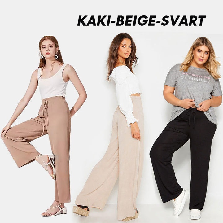 "Dam plus size vida byxor med hög midja, i silkesmjukt tyg och olika färger, elegant draperade för stil och komfort."