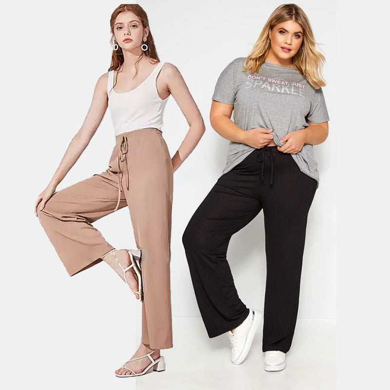 "Dam plus size vida byxor med hög midja, i silkesmjukt tyg och olika färger, elegant draperade för stil och komfort."