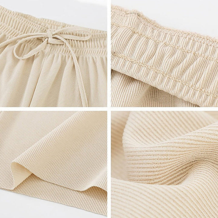"Dam plus size vida byxor med hög midja, i silkesmjukt tyg och olika färger, elegant draperade för stil och komfort."