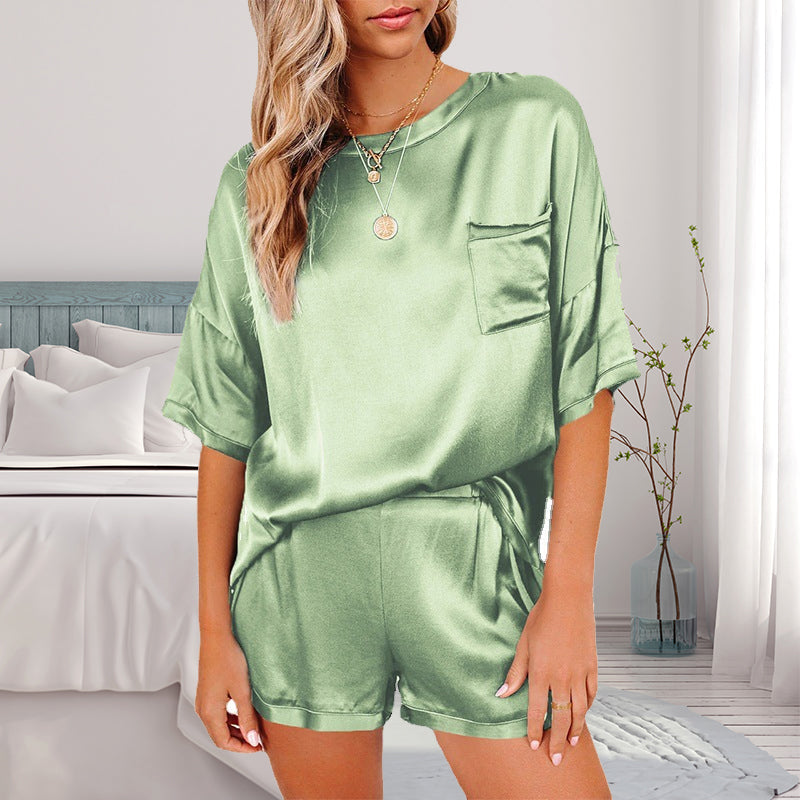 "Dam pyjamas set i enfärgad polyester, flera färgval, avslappnad passform med ficka, perfekt för komfort och stil."