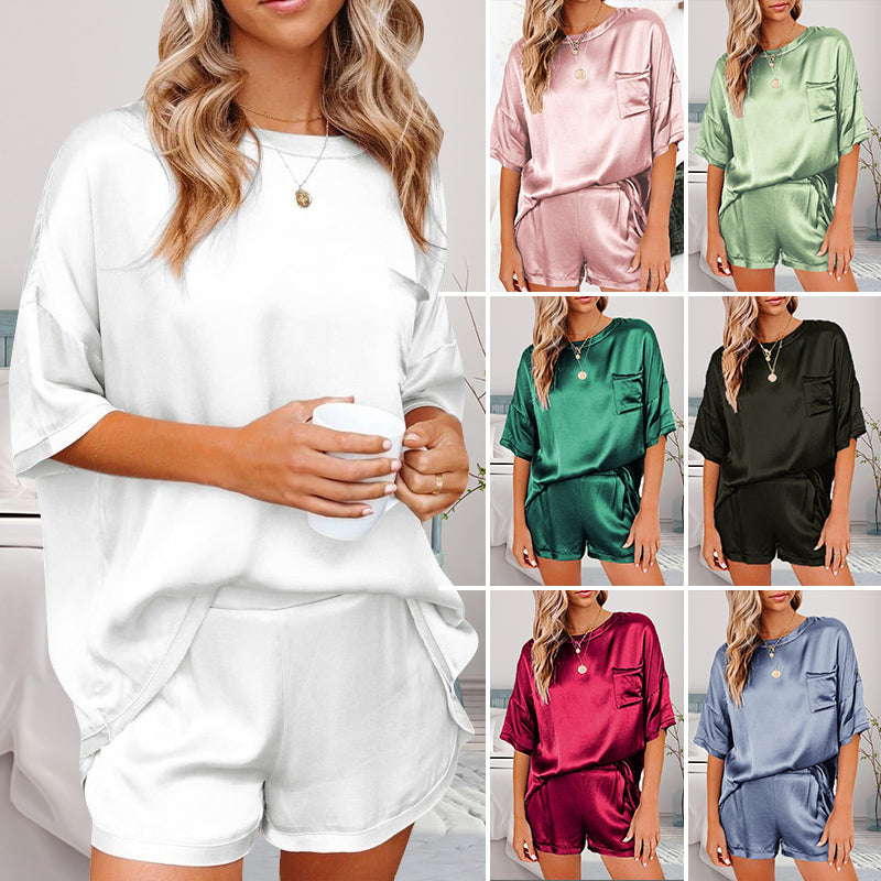 "Dam pyjamas set i enfärgad polyester, flera färgval, avslappnad passform med ficka, perfekt för komfort och stil."