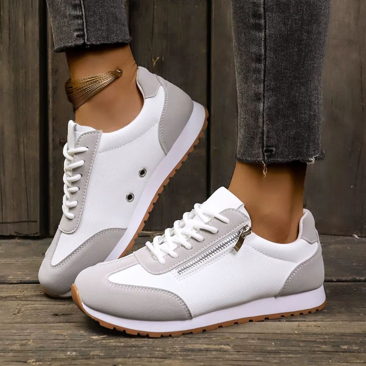 Stilrena dam sneakers i modern design. Fotriktiga vardagsskor för en aktiv livsstil med komfort.