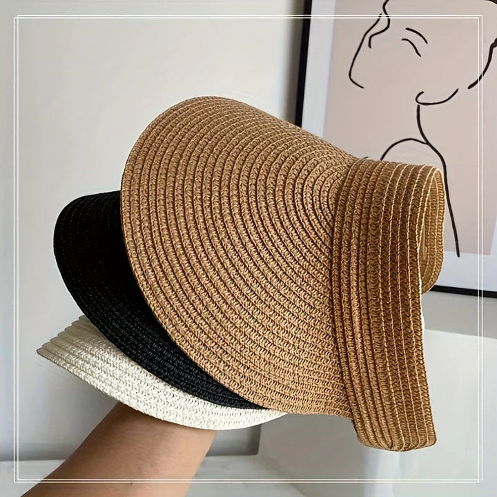 Elegant damhatt med brett brätte, vikbar solhatt. Ger utmärkt UV-skydd för sommarens äventyr och stranddagar.