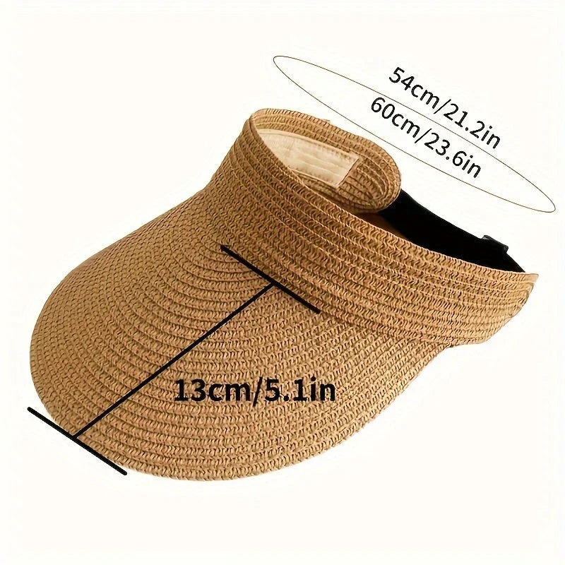 Modern vikbar solhatt för dam med bred brätte. Idealisk för solskydd på stranden eller semester, en praktisk accessoar.