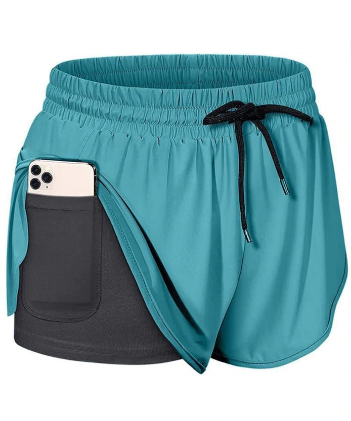 "Dam sportshorts i nylon och spandex, mjukt tyg, flera färger, avslappnad passform, perfekt för träning och fritid."
