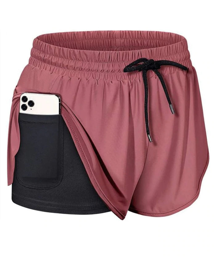 "Dam sportshorts i nylon och spandex, mjukt tyg, flera färger, avslappnad passform, perfekt för träning och fritid."