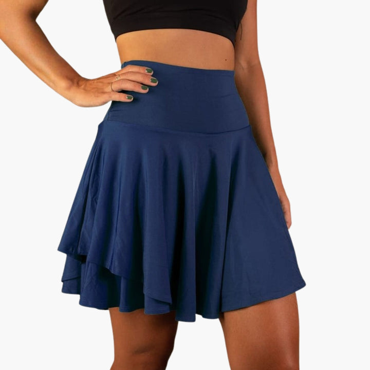 Dam sportskort med hög midja och inbyggda shorts för optimal komfort under träning och aktivitet.