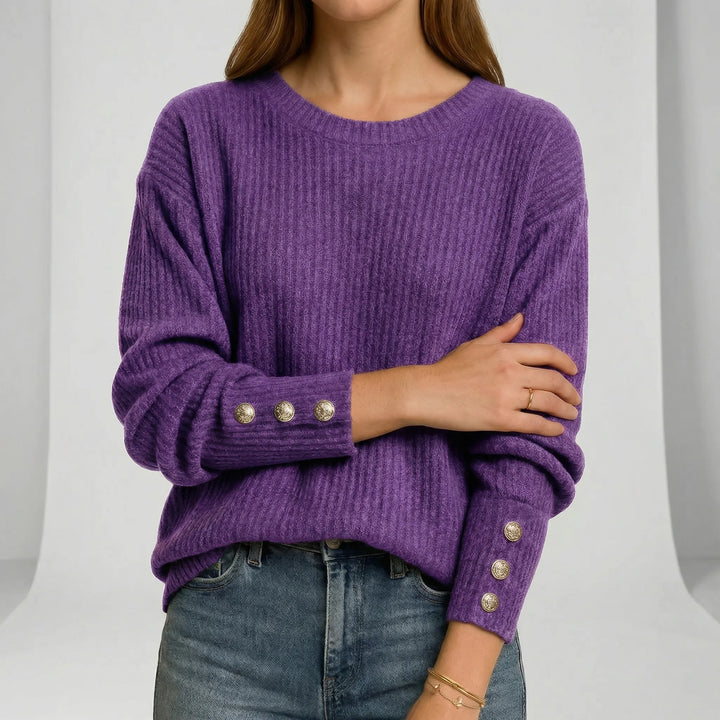Flerfärgad stickad damtröja med lös passform. Trendig och bekväm rundhalsad jumper för elegant höstmode.