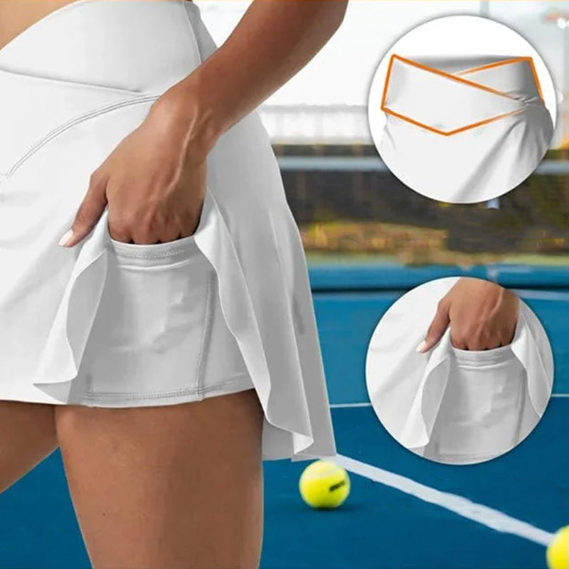 Dam stretchiga tennisbyxor med fickor, V-formad midjeband, chic grå design, praktiska fickor för sport och vardag.