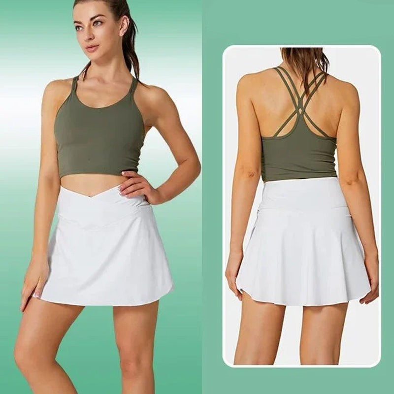 Dam stretchiga tennisbyxor med fickor, V-formad midjeband, chic grå design, praktiska fickor för sport och vardag.