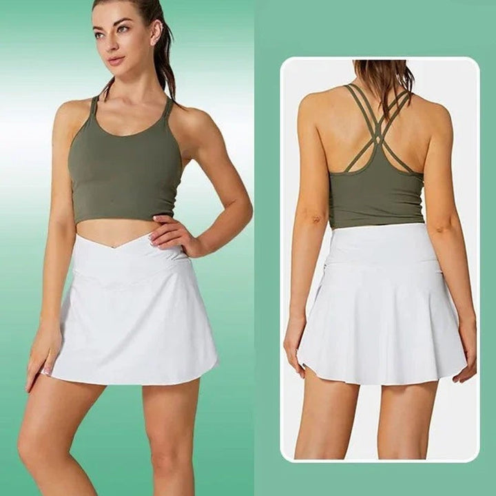 Dam stretchiga tennisbyxor med fickor, V-formad midjeband, chic grå design, praktiska fickor för sport och vardag.