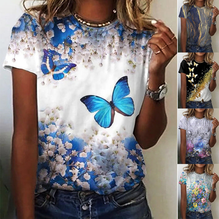 "Dam t-shirt med rund hals och kort ärm; grafiktryck av blommor och fjärilar, perfekt för vardagsbruk."