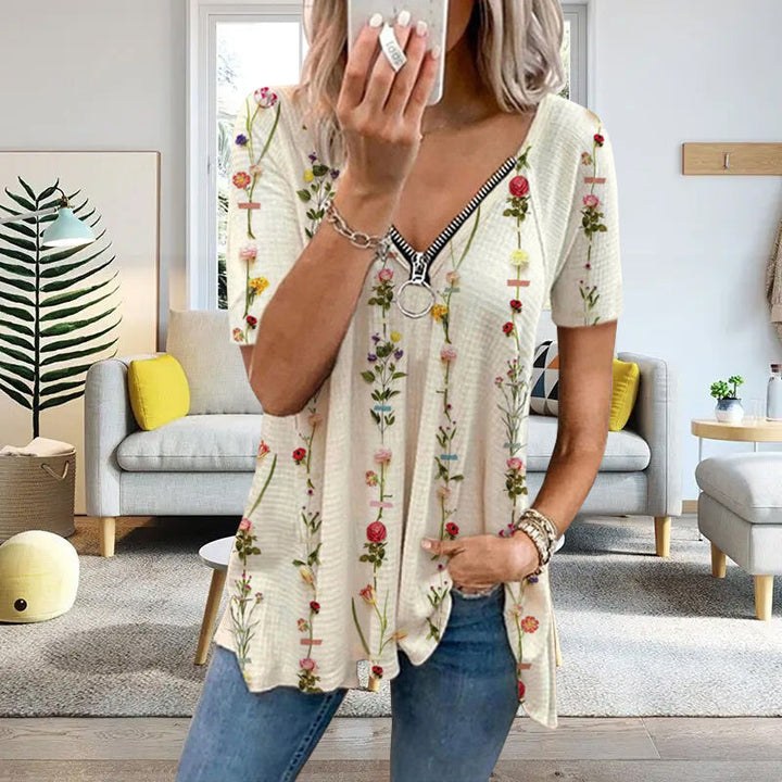 "Dam V-ringad blommig T-shirt med kortärmad design och modern dragkedja. Perfekt för sommarens vardagsbruk."