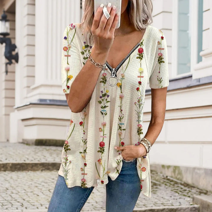 "Dam V-ringad blommig T-shirt med kortärmad design och modern dragkedja. Perfekt för sommarens vardagsbruk."