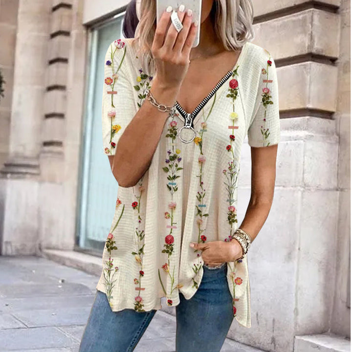 "Dam V-ringad blommig T-shirt med kortärmad design och modern dragkedja. Perfekt för sommarens vardagsbruk."