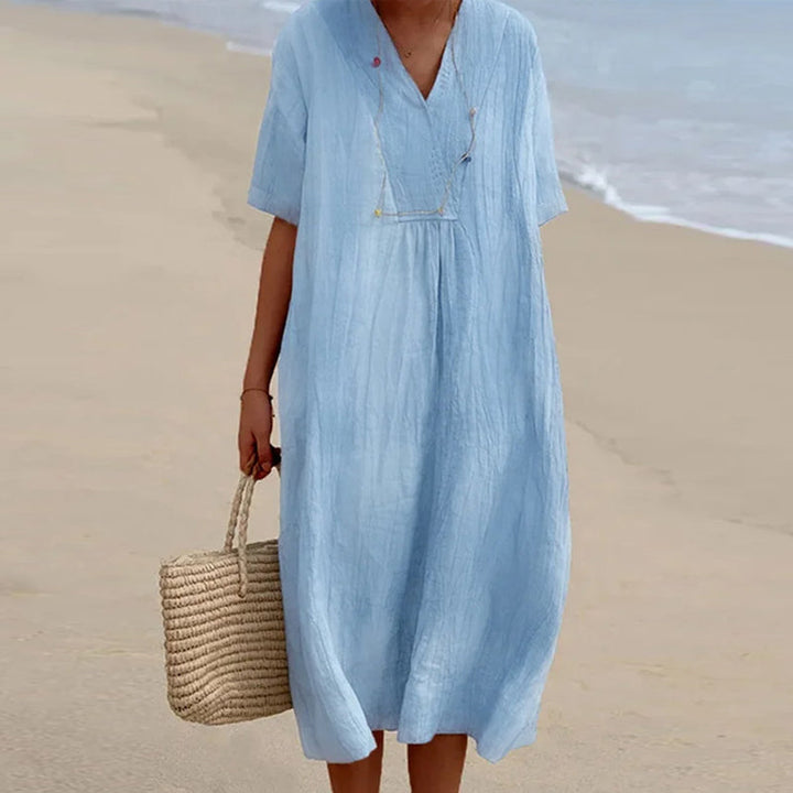 Dam V-ringad kortärmad enfärgad midi-klänning i mjuk bomull, perfekt för sommar, strand och vardag, chic och elegant.