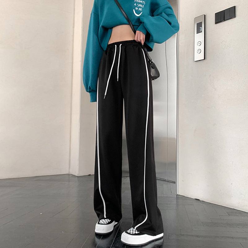 "Dam vida höga midjebyxor med randigt mönster i polyester, kontor och casual stil, framifrån visning."